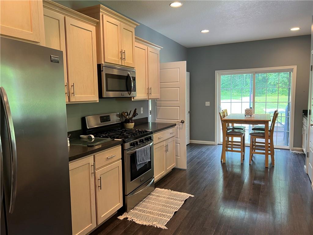 3643 Longview Road Hermitage, PA 16148 - Photo 6 of 23 a kitchen with granite countertop wooden floors and stainless steel appliances