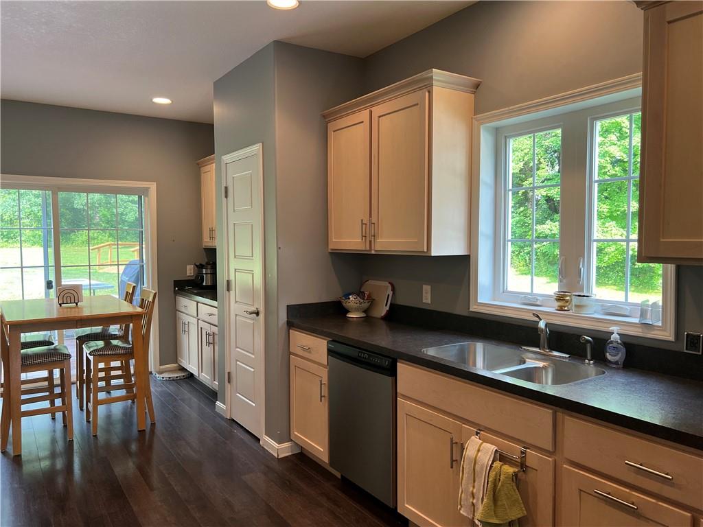 3643 Longview Road Hermitage, PA 16148 - Photo 7 of 23 a kitchen with stainless steel appliances granite countertop a stove a sink and a refrigerator