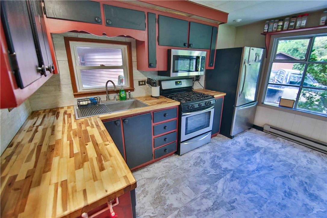 8 Cross Rds Drive Jim Thorpe, PA 18229 - Photo 7 of 32 Butcher block countertops and updated appliances provide a functional, stylish culinary space.