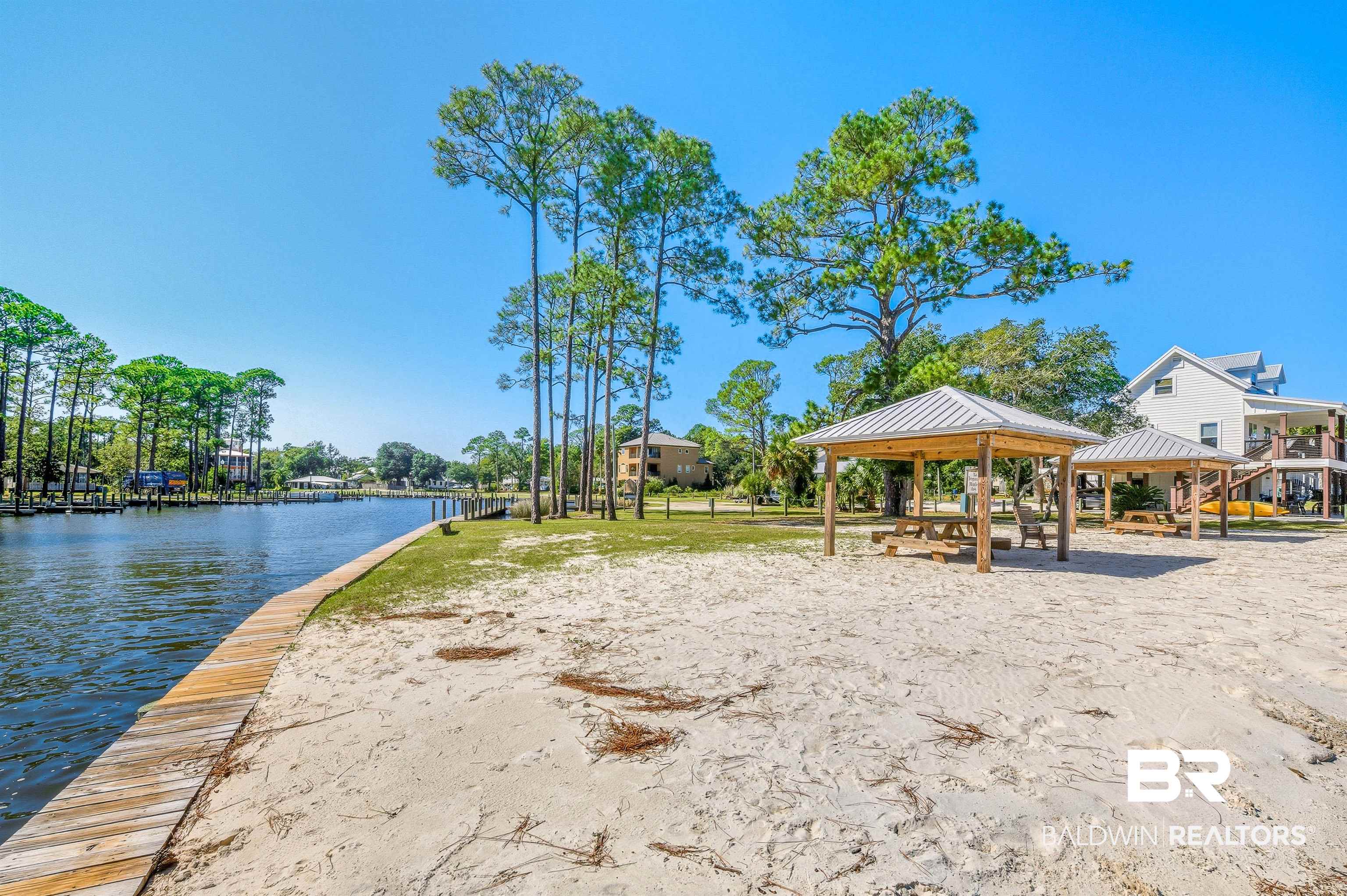 5310 Pine Road Orange Beach, AL 36561 - Photo 28 of 46 View of community featuring a patio, a water view, and a gazebo