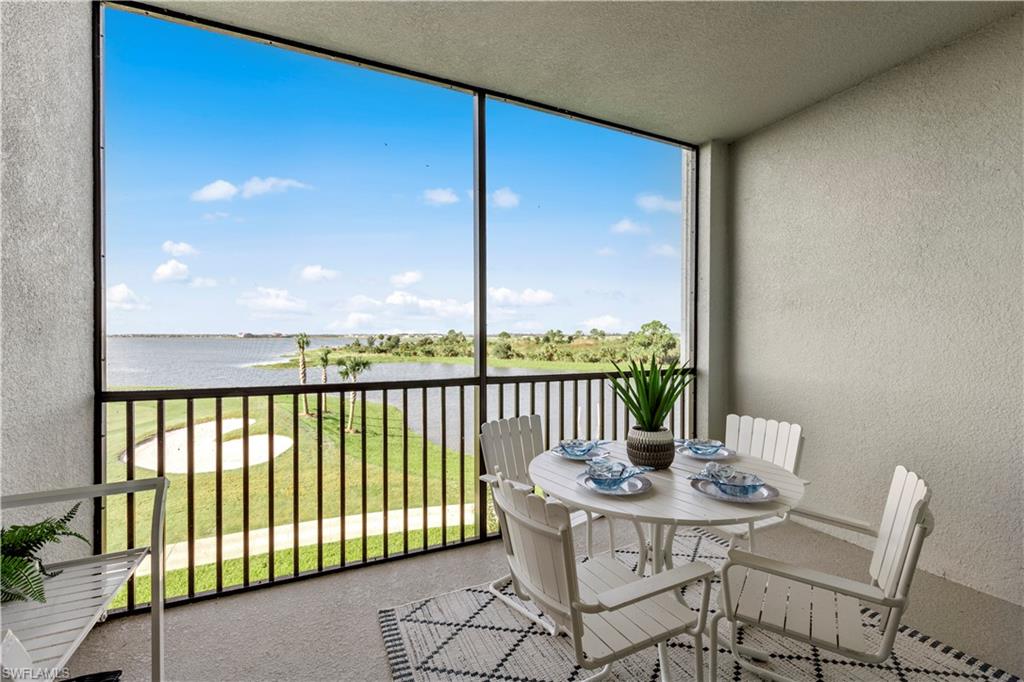 5715 Double Eagle Circle, Unit 4414 Immokalee, FL 34142 - Photo 19 of 20 a view of a balcony with a table and chairs