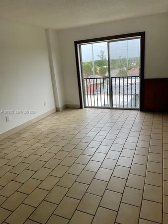 a view of a refrigerator in kitchen and wooden floor