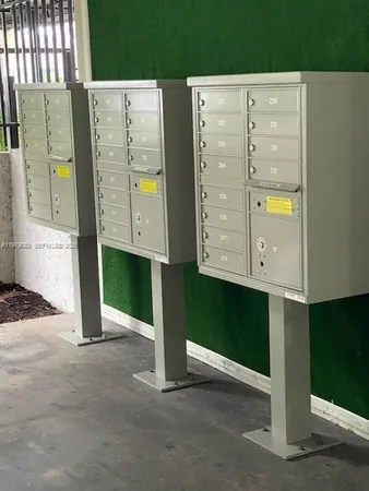 a view of swimming pool with a lounge chairs