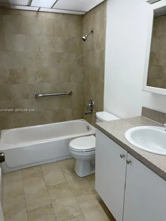 a bathroom with a sink a toilet and a bathtub