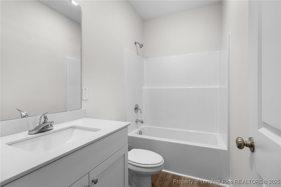 501 Traveller Way Raeford, NC 28376 - Photo 12 of 49 a bathroom with a sink a toilet and shower