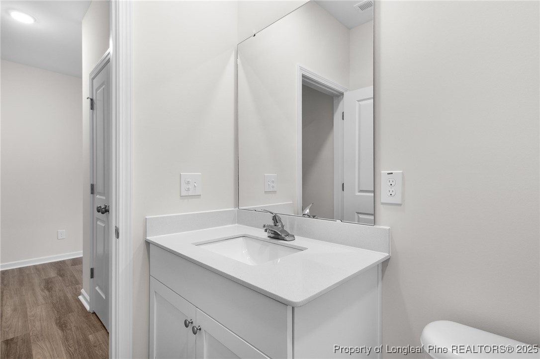 501 Traveller Way Raeford, NC 28376 - Photo 13 of 49 a bathroom with a sink toilet and a mirror