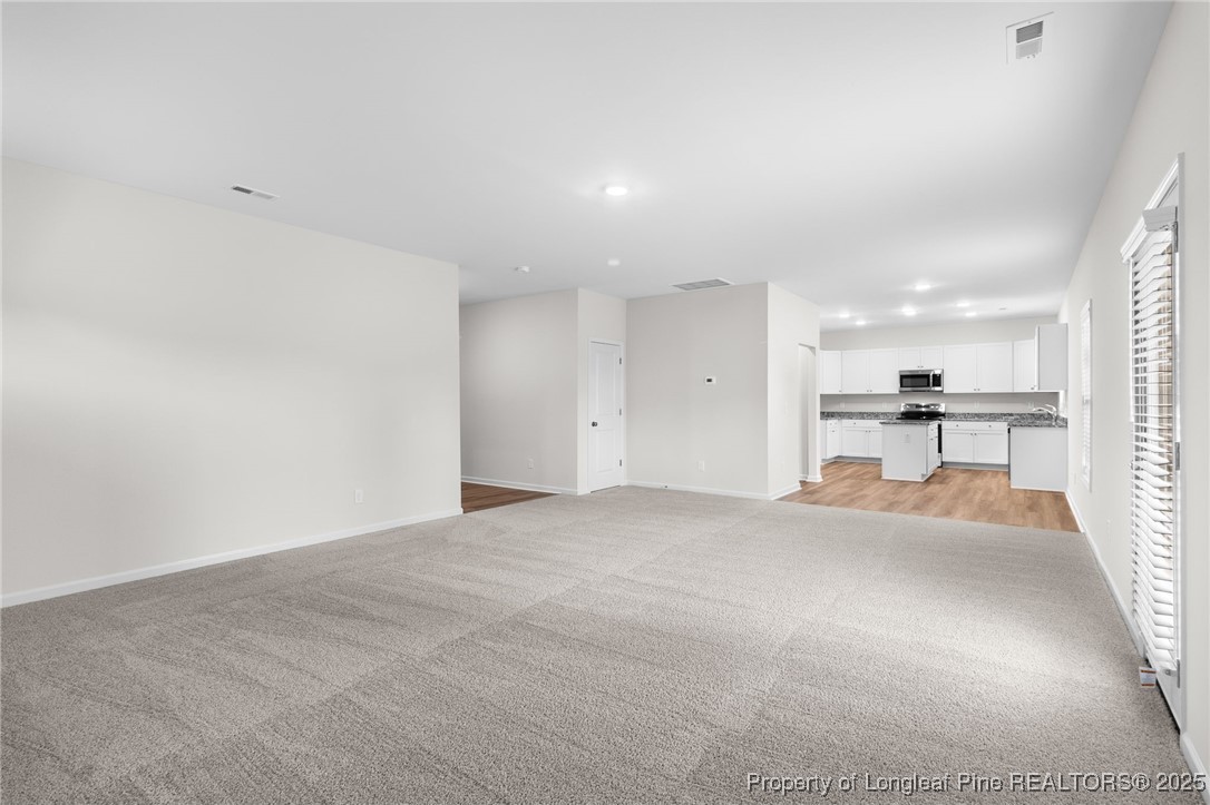 501 Traveller Way Raeford, NC 28376 - Photo 14 of 49 a view of a kitchen with a sink and a refrigerator