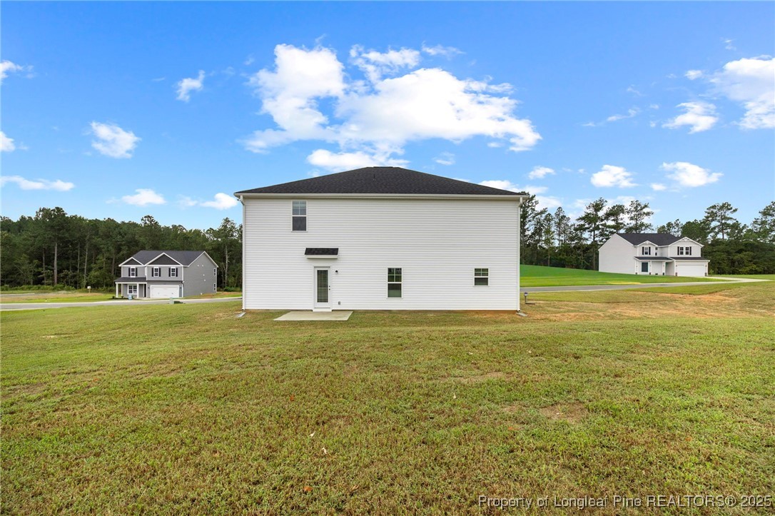 501 Traveller Way Raeford, NC 28376 - Photo 2 of 49 a view of a house with a yard