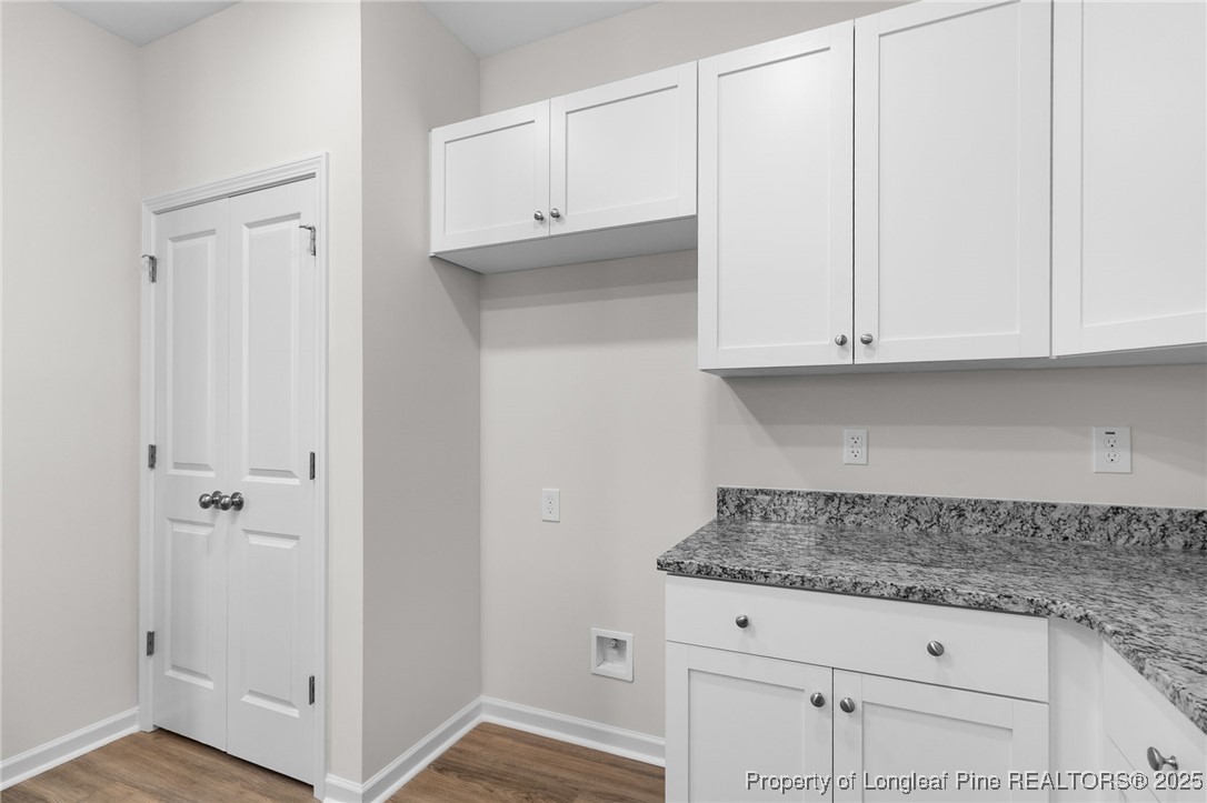 501 Traveller Way Raeford, NC 28376 - Photo 22 of 49 a kitchen with granite countertop white cabinets and a white appliances