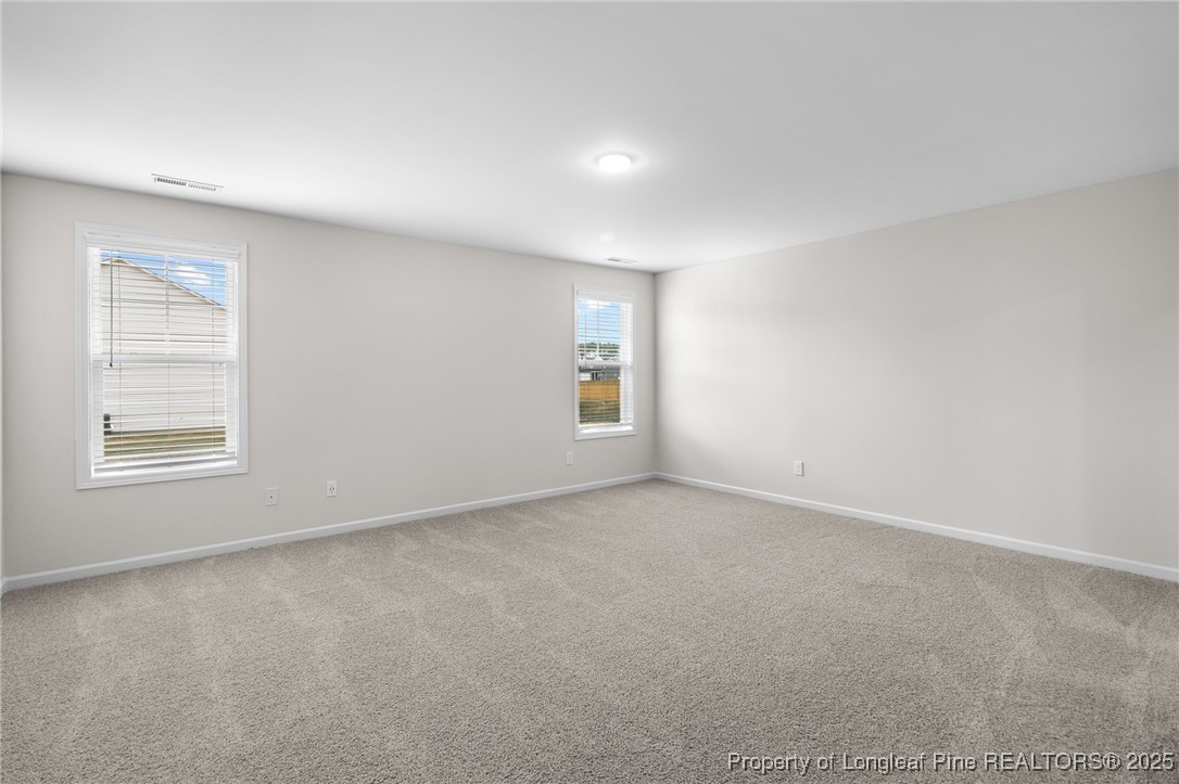 501 Traveller Way Raeford, NC 28376 - Photo 25 of 49 a view of an empty room with a window