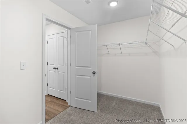 a bedroom with a bed and a table