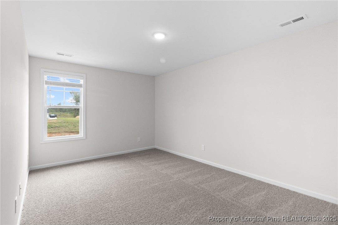501 Traveller Way Raeford, NC 28376 - Photo 32 of 49 an empty room with a window