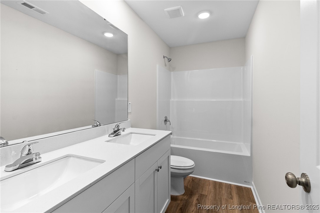 501 Traveller Way Raeford, NC 28376 - Photo 36 of 49 a bathroom with a sink and a mirror