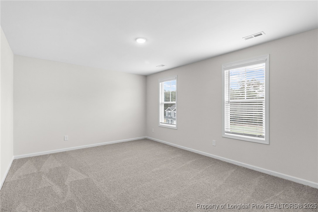 501 Traveller Way Raeford, NC 28376 - Photo 37 of 49 an empty room with a window