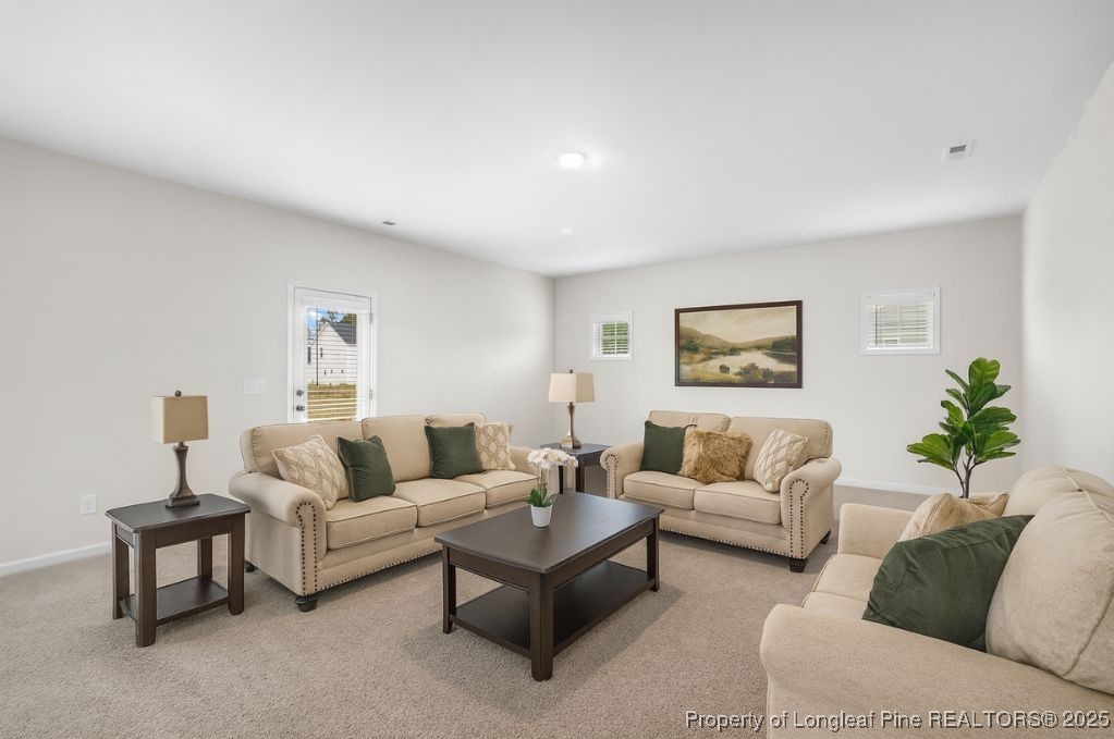 501 Traveller Way Raeford, NC 28376 - Photo 4 of 49 a living room with furniture and a wooden floor