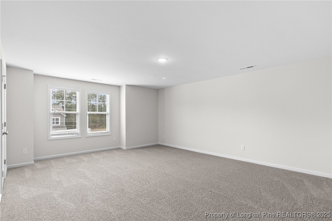 501 Traveller Way Raeford, NC 28376 - Photo 41 of 49 an empty room with a window