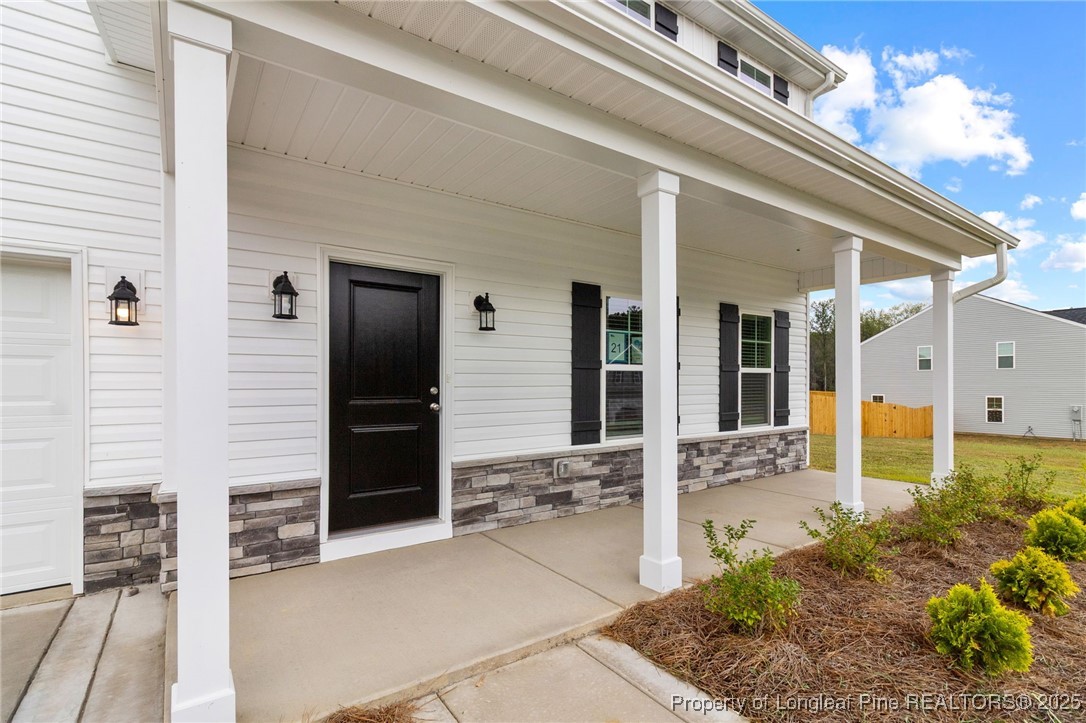 501 Traveller Way Raeford, NC 28376 - Photo 42 of 49 a view of house with patio