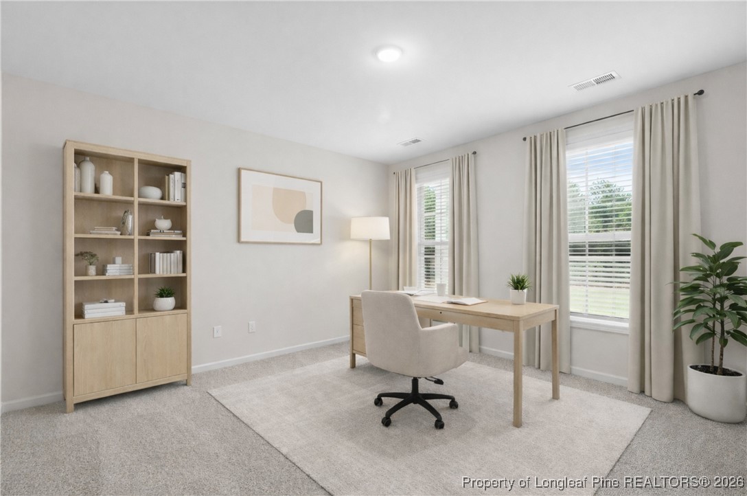 501 Traveller Way Raeford, NC 28376 - Photo 8 of 49 a view of a workspace with furniture and a window