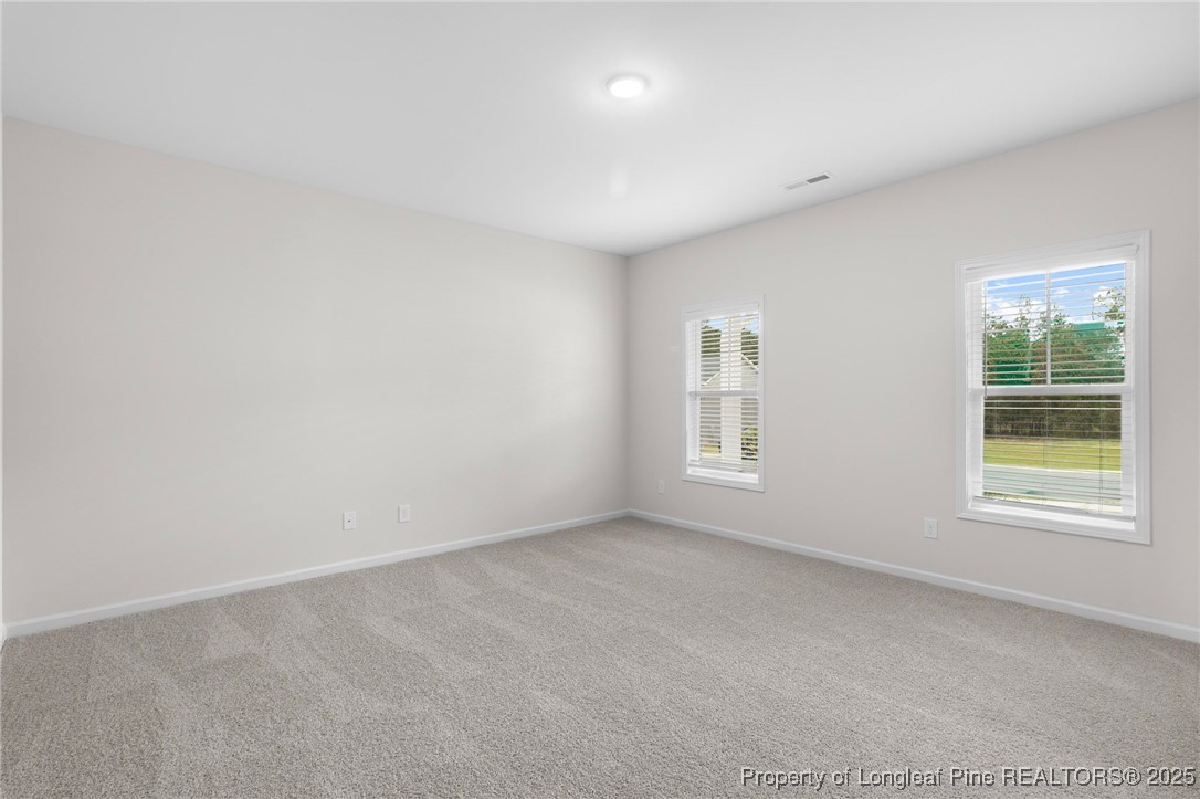 501 Traveller Way Raeford, NC 28376 - Photo 9 of 49 an empty room with windows