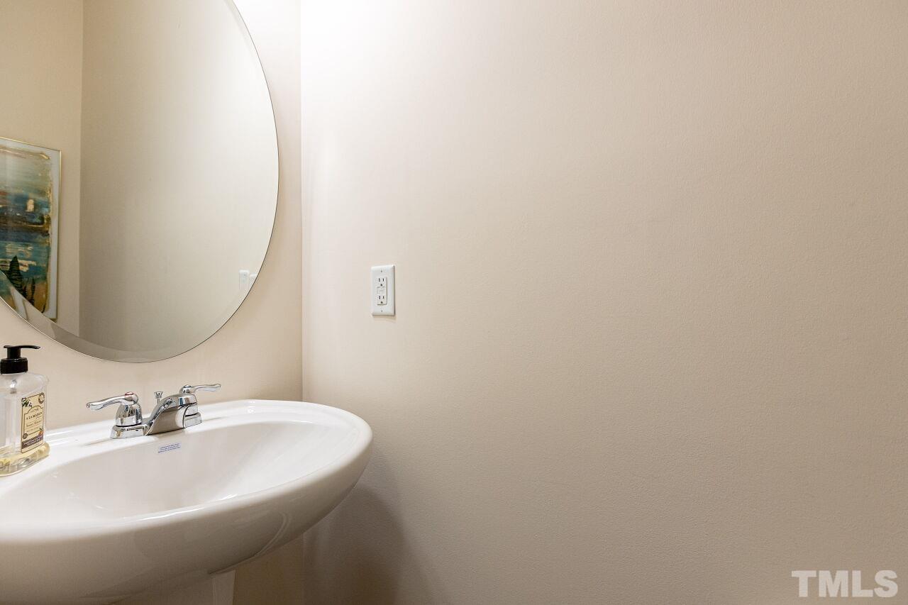 117 Lafferty Street Durham, NC 27560 - Photo 15 of 43 a bathroom with a sink and a mirror