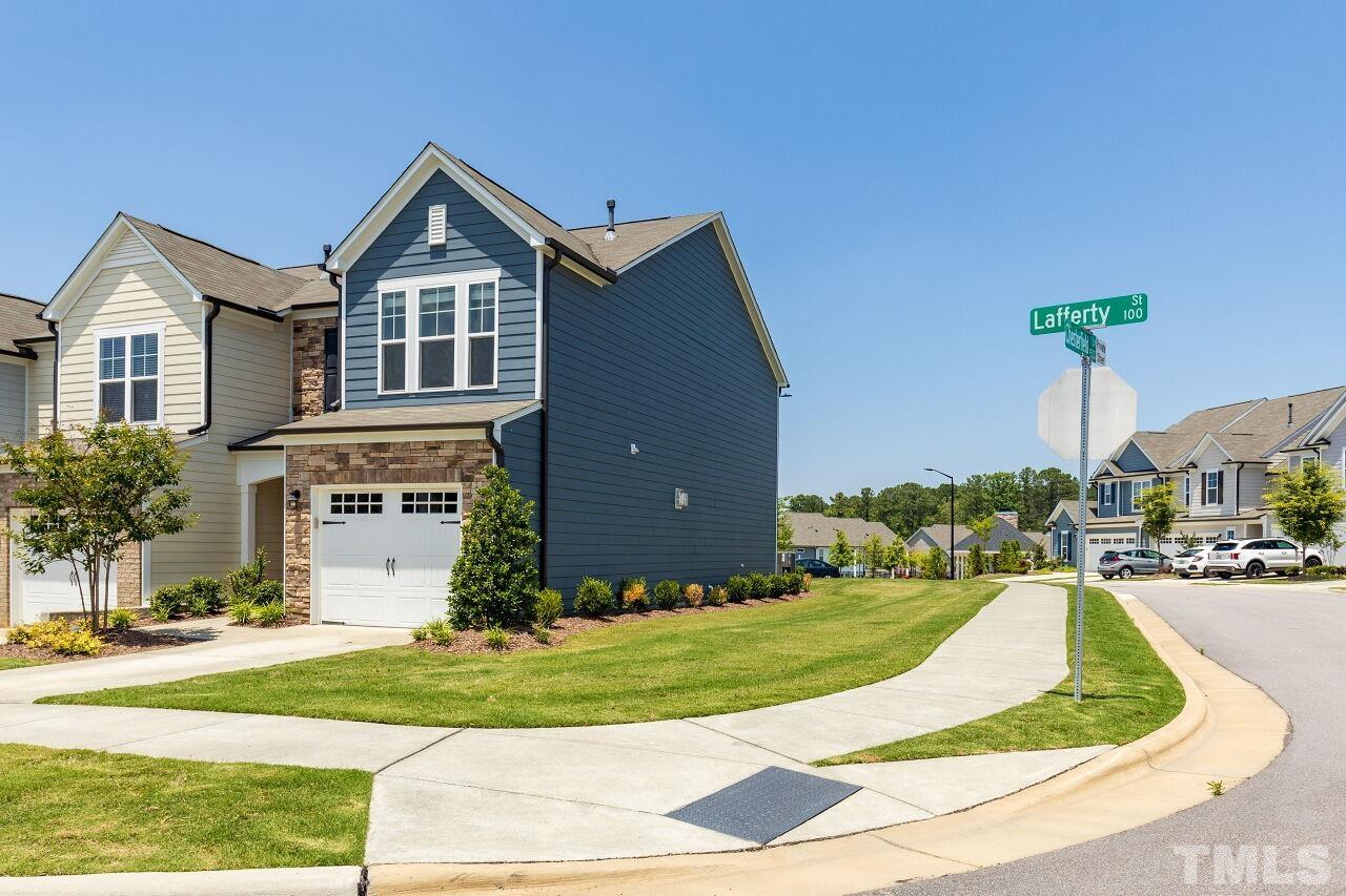 117 Lafferty Street Durham, NC 27560 - Photo 2 of 43 a front view of a house with a yard