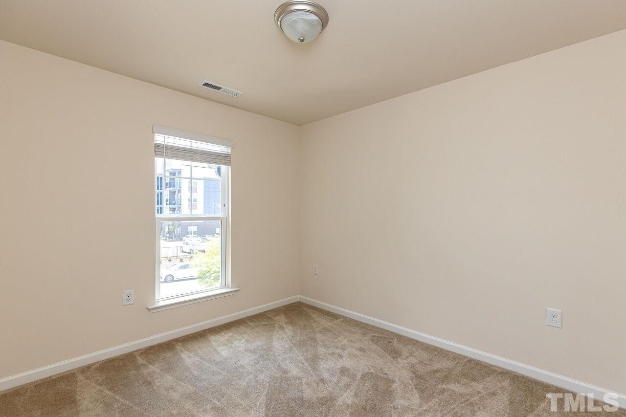 117 Lafferty Street Durham, NC 27560 - Photo 25 of 43 an empty room with windows