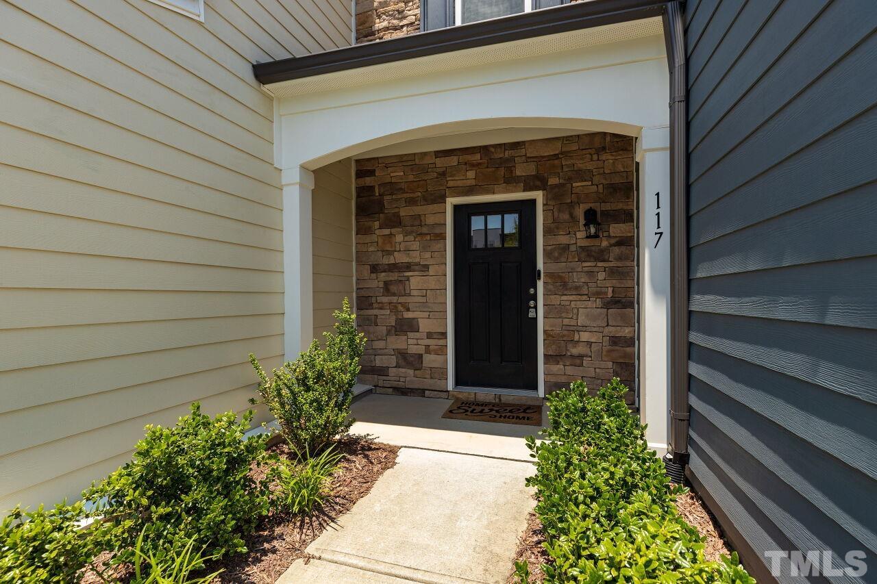 117 Lafferty Street Durham, NC 27560 - Photo 28 of 43 a front view of a house with garden