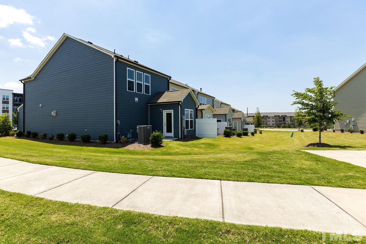 117 Lafferty Street Durham, NC 27560 - Photo 30 of 43 a front view of a house with a yard