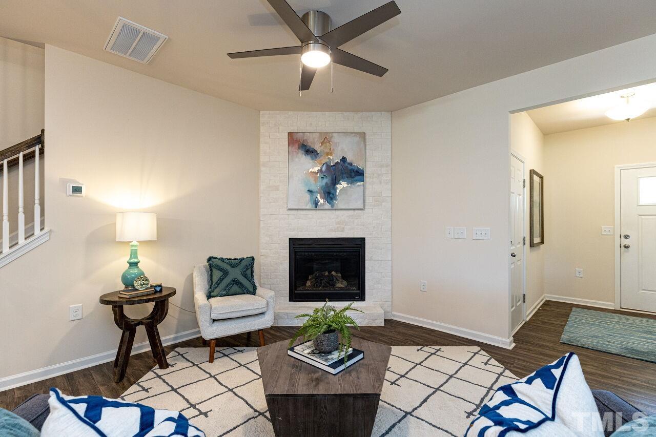 117 Lafferty Street Durham, NC 27560 - Photo 3 of 43 a living room with furniture and a fireplace