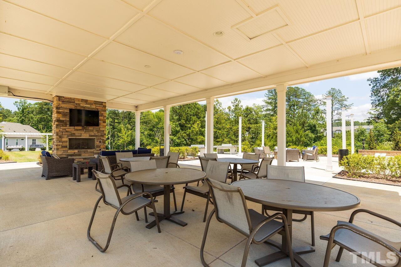 117 Lafferty Street Durham, NC 27560 - Photo 34 of 43 a view of a patio with a dining table and chairs