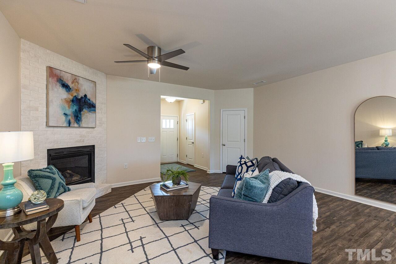 117 Lafferty Street Durham, NC 27560 - Photo 6 of 43 a living room with furniture and a fireplace