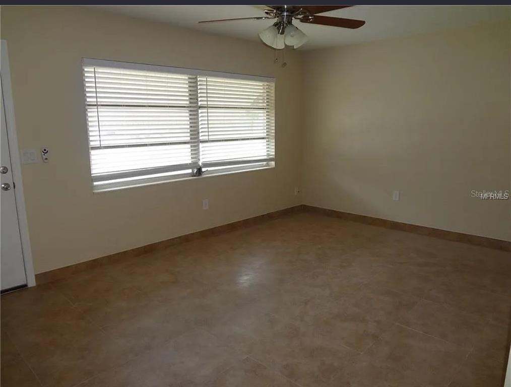 6439 Polk Street New Port Richey, FL 34653 - Photo 4 of 11 an empty room with a window