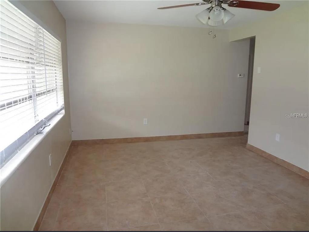 6439 Polk Street New Port Richey, FL 34653 - Photo 5 of 11 an empty room with a window
