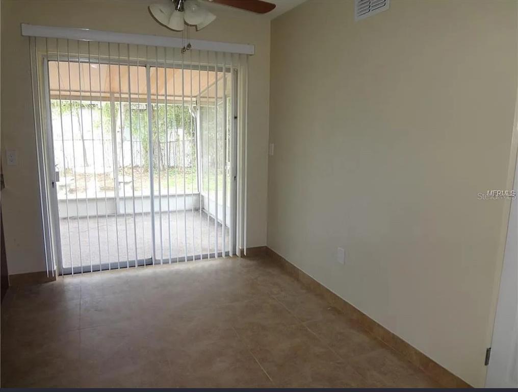 6439 Polk Street New Port Richey, FL 34653 - Photo 6 of 11 a view of an empty room and a window