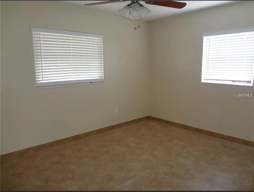 6439 Polk Street New Port Richey, FL 34653 - Photo 7 of 11 an empty room with a window