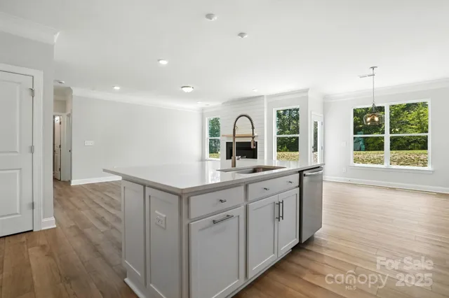 a bathroom with a double vanity sink and a large mirror