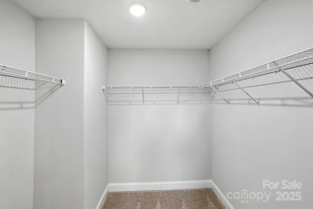 a view of a room with racks on the wall