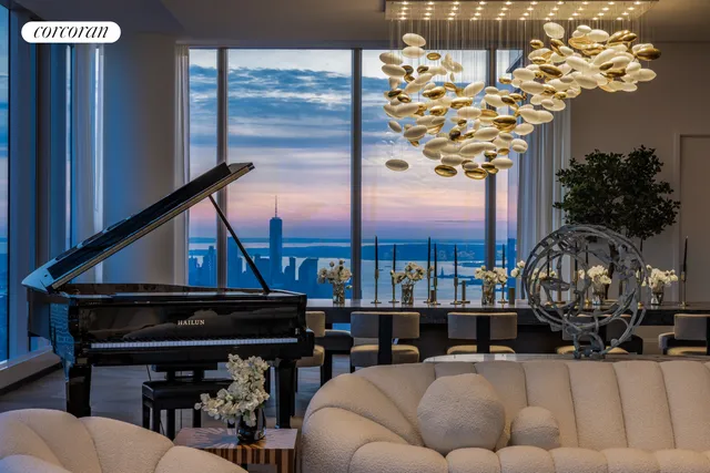 a living room with furniture and large windows