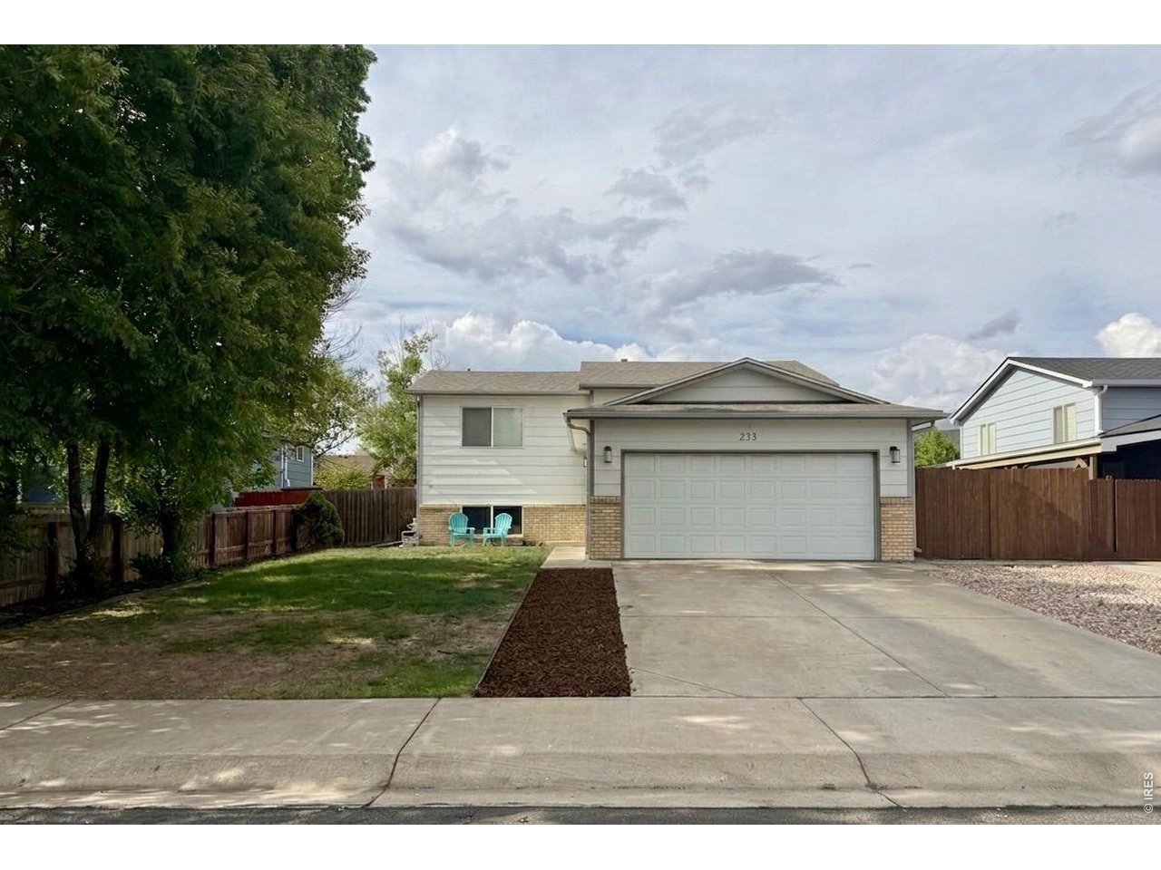 233 East 19th Street Road Greeley, CO 80631 - Photo 2 of 22 a view of house and yard