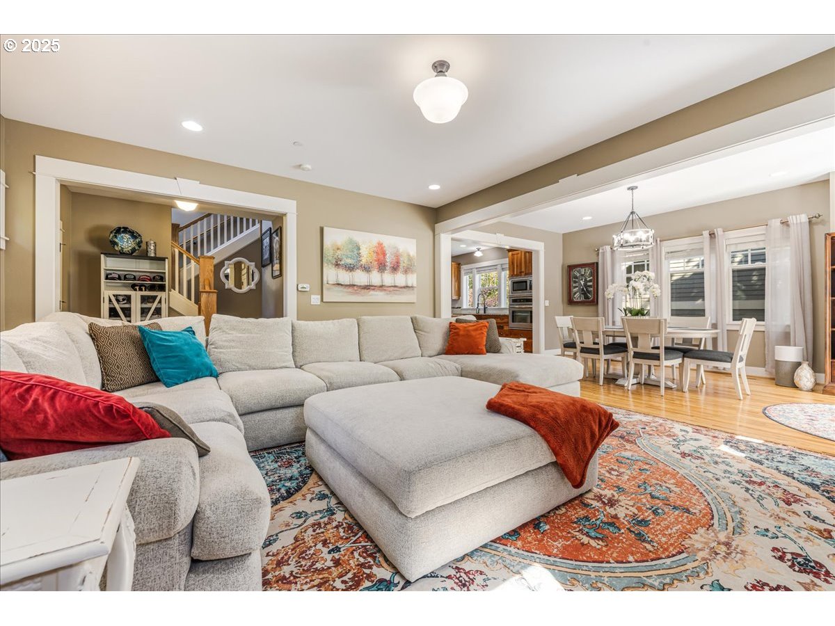8250 Southwest Indigo Terrace Beaverton, OR 97007 - Photo 11 of 46 a living room with furniture potted plant and a large window