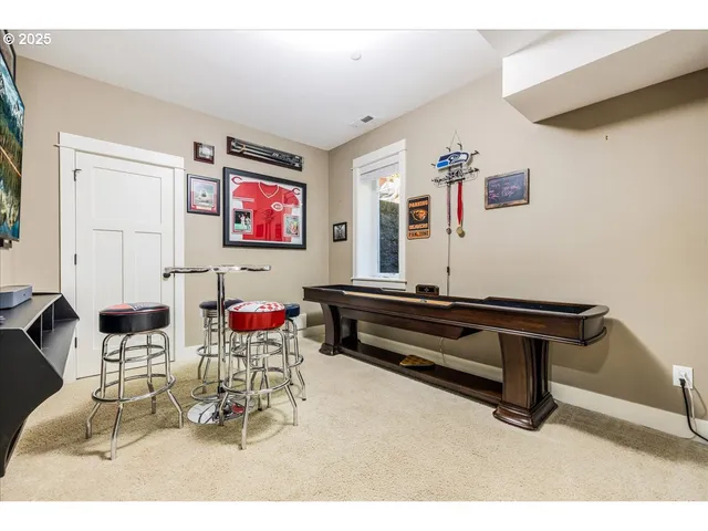 a reading room with furniture and wooden floor