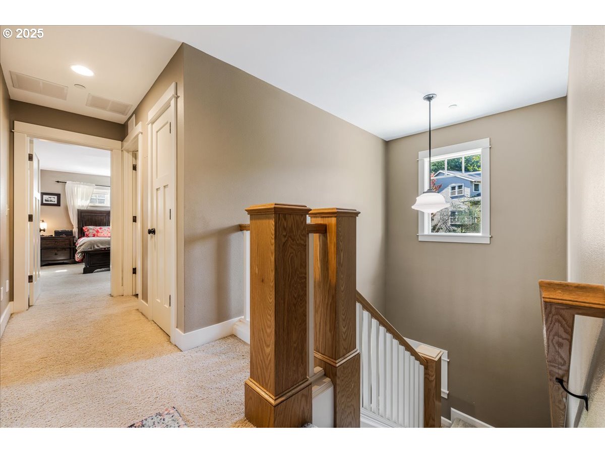 8250 Southwest Indigo Terrace Beaverton, OR 97007 - Photo 24 of 46 a view of a hallway with a bedroom