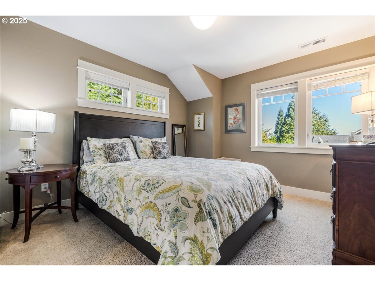 8250 Southwest Indigo Terrace Beaverton, OR 97007 - Photo 32 of 46 a bedroom with a bed and window
