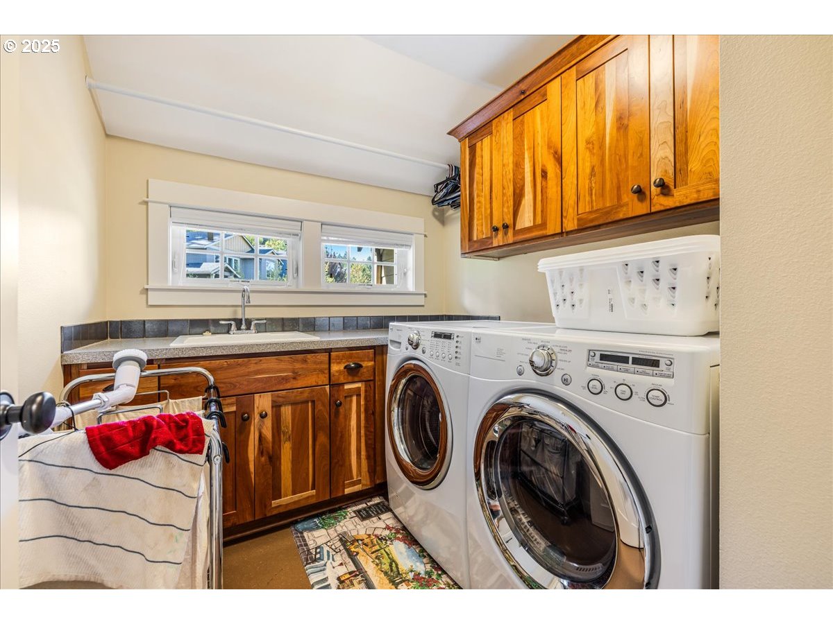 8250 Southwest Indigo Terrace Beaverton, OR 97007 - Photo 36 of 46 a utility room with dryer and washer