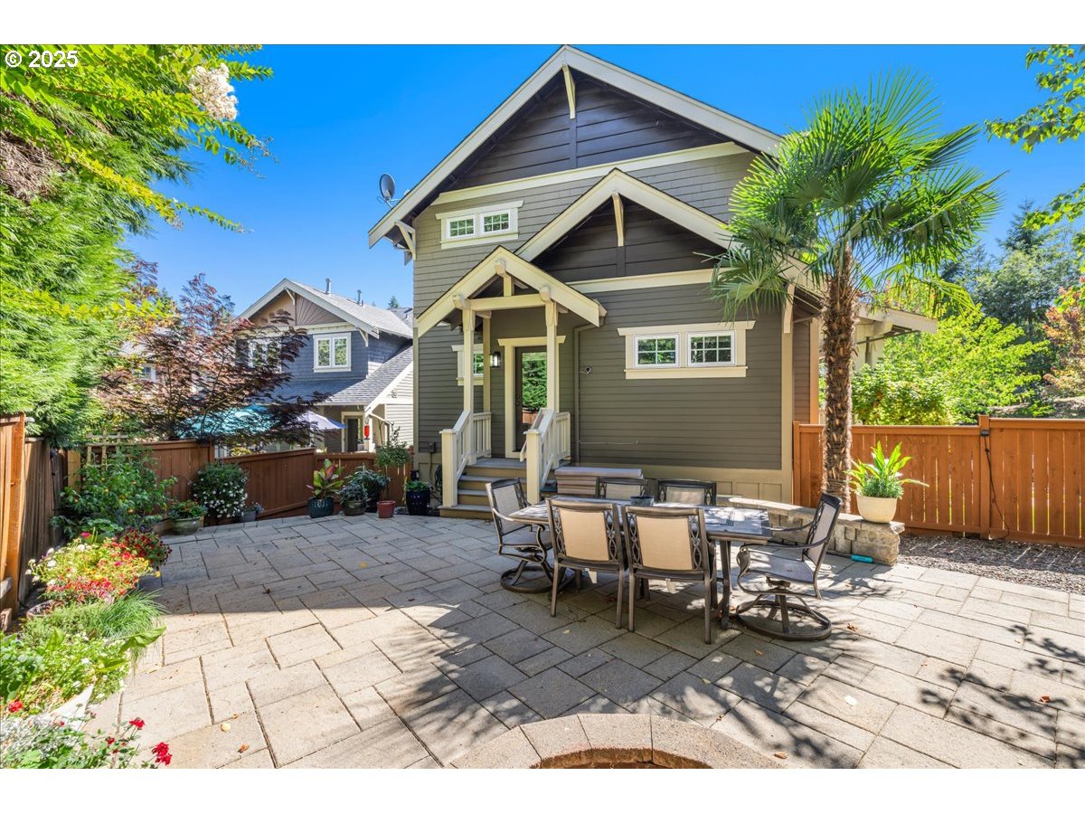 8250 Southwest Indigo Terrace Beaverton, OR 97007 - Photo 39 of 46 a backyard of a house with table and chairs