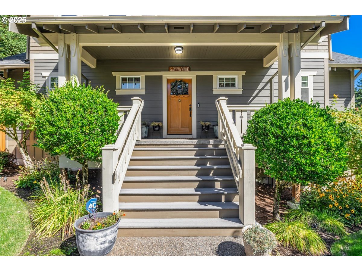 8250 Southwest Indigo Terrace Beaverton, OR 97007 - Photo 6 of 46 a front view of a house with a yard