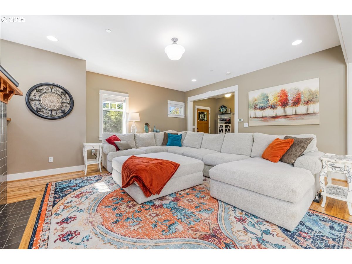 8250 Southwest Indigo Terrace Beaverton, OR 97007 - Photo 10 of 46 a living room with furniture a rug and a window
