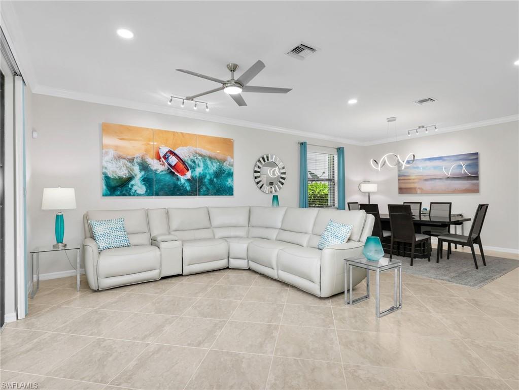 4383 Bismark Way Naples, FL 34119 - Photo 14 of 49 Living Room & Dining Room both with Crown Molding & Track Lighting