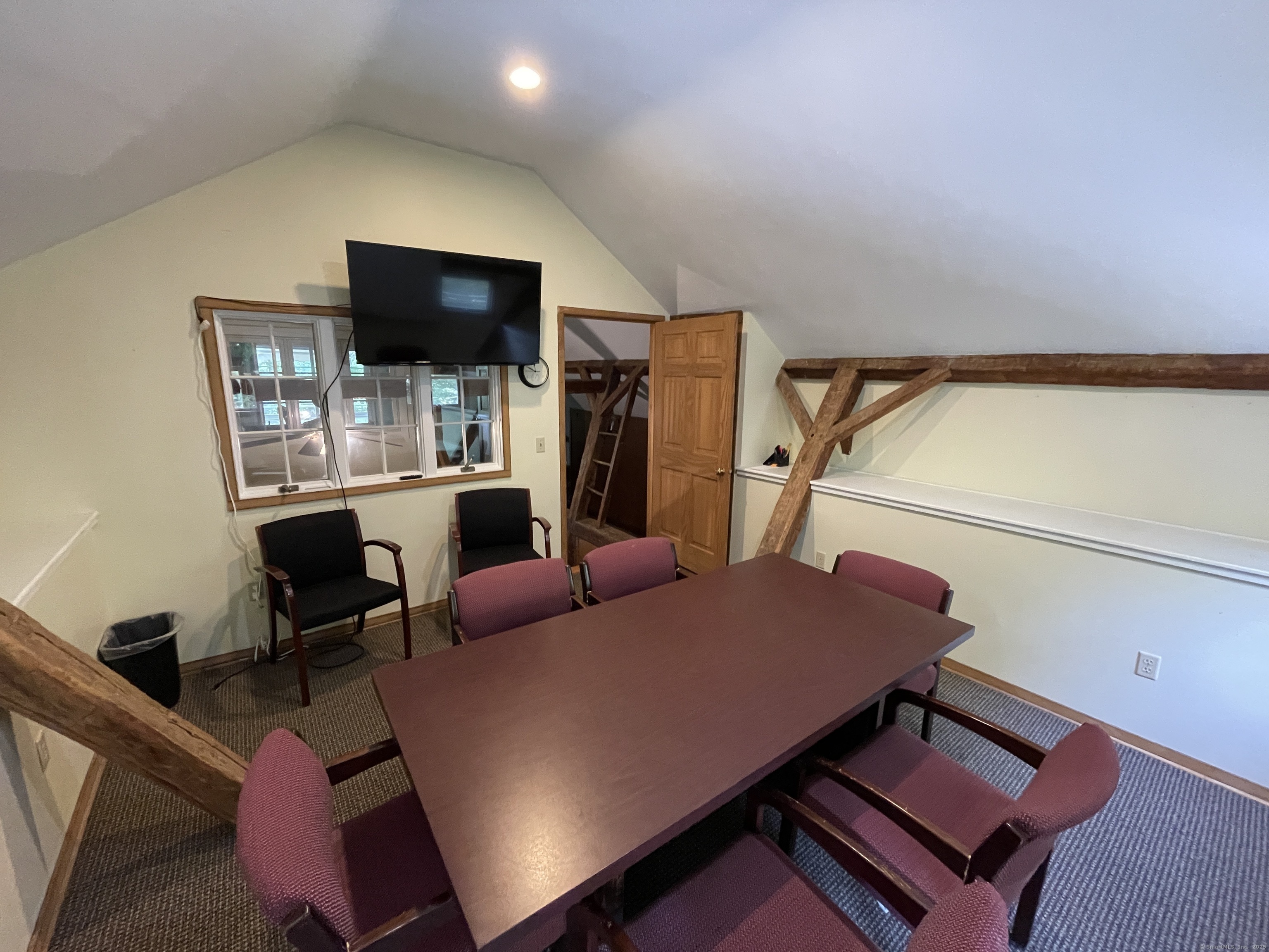 167 Baxter Road Mansfield, CT 06268 - Photo 22 of 22 a living room with furniture a flat screen tv and kitchen view