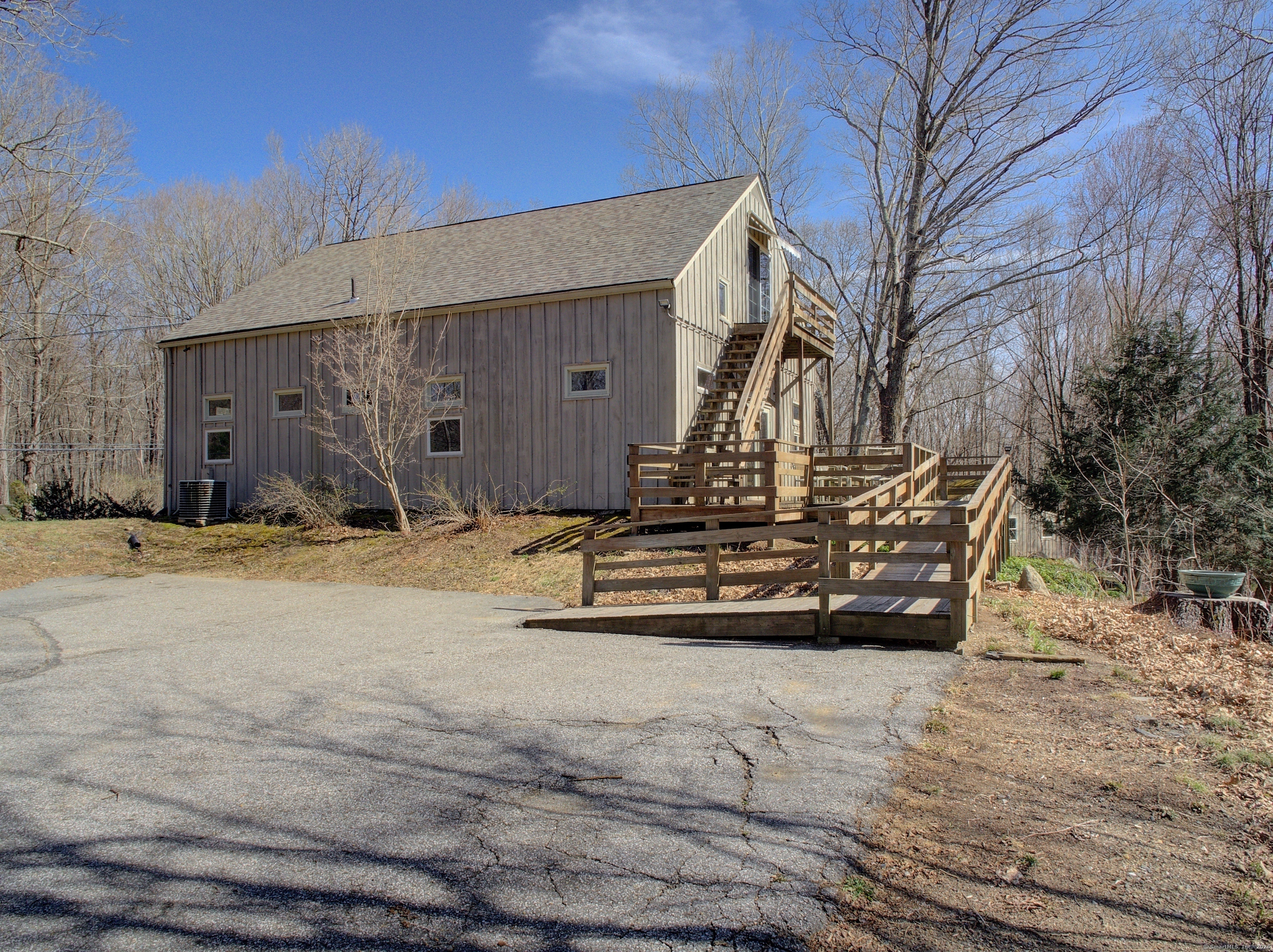167 Baxter Road Mansfield, CT 06268 - Photo 5 of 22 a view of a house with snow on the side of the road